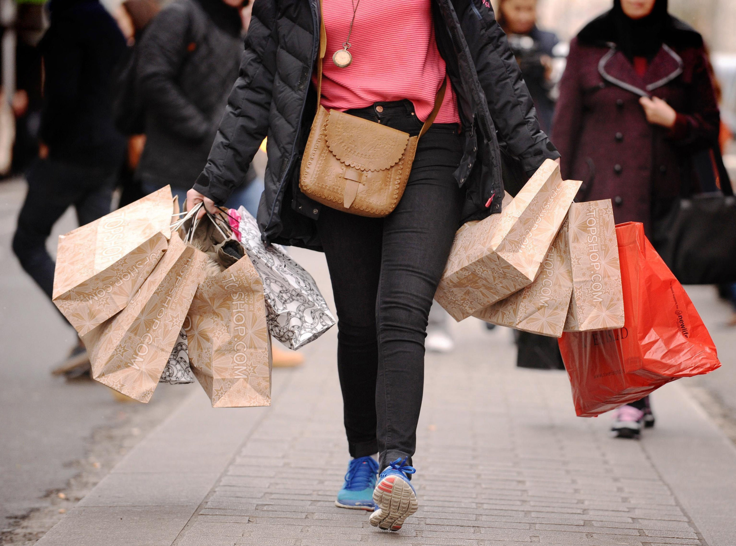 A shopper carries bags.