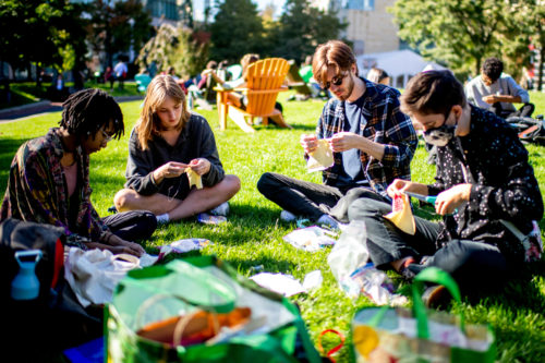 Students in the information design course work on a sewing project at Centennial Common Wednesday, Oct. 6, 2021. Photo by Matthew Modoono/Northeastern University