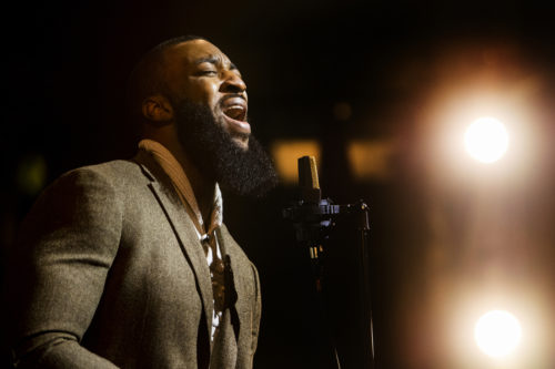 Northeastern alum Kwesi Abakah performs “A Change is Gonna Come” for the upcoming MLK event, in Blackman Auditorium on Jan. 11, 2022. Photo by Matthew Modoono/Northeastern University