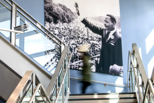 A member of the Northeastern community walks up the stairs in the John D. O'Bryant African-American Institute.  Photo by Matthew Modoono/Northeastern University
