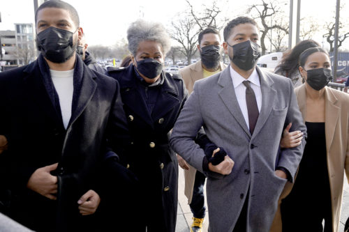 Actor Jussie Smollett, center, arrives with family Thursday, Dec. 2, 2021, at the Leighton Criminal Courthouse on day four of his trial in Chicago. Smollett is accused of lying to police when he reported he was the victim of a racist, anti-gay attack in downtown Chicago nearly three years ago. AP Photo/Charles Rex Arbogast