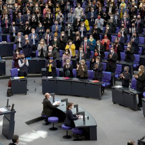Lawmakers applaud during German Chancellor Olaf Scholz' speech on the Russian invasion of the Ukraine during a meeting of the German federal parliament, Bundestag, at the Reichstag building in Berlin, Germany, Feb. 27, 2022. Nowhere has the change been more pronounced than in Germany, the European Union's leading economic power but also a country that has been reluctant to invest heavily in military power, in large part because of its militaristic past which resulted in the horror of World War II.