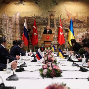 In this photo provided by Turkish Presidency, Turkish President Recep Tayyip Erdogan, center, gives a speech to welcome the Russian, left, and Ukrainian delegations ahead of their talks, in Istanbul, Turkey, Tuesday, March 29, 2022.