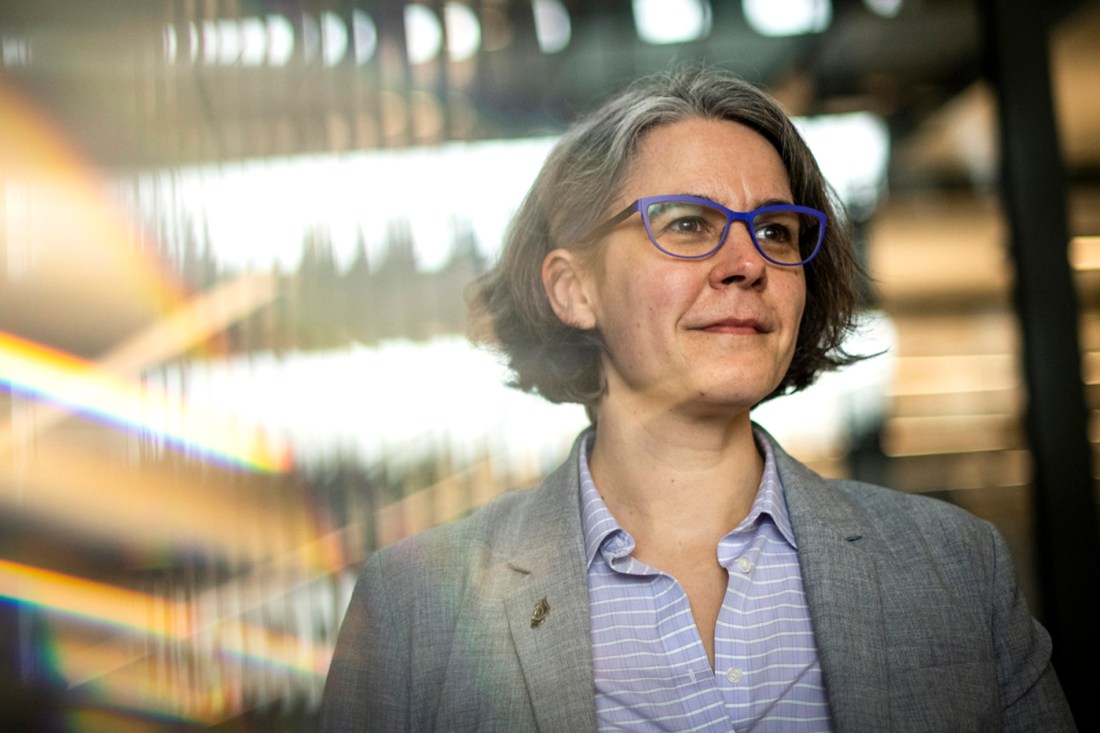 Headshot of Xander Meise wearing glasses and a gray suit jacket