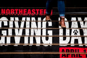 A Giving Day poster on Northeastern's Boston campus.