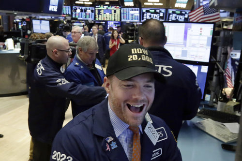 Specialist Frank Masiello wears a Dow 20,000 cap as he works on the floor of the New York Stock Exchange, Wednesday, Jan. 25, 2017. The Dow Jones industrial average is trading over 20,000 points for the first time, the latest milestone in a record-setting drive for the stock market. The market has been marching steadily higher since bottoming out in March 2009 in the aftermath of the financial crisis. (AP Photo/Richard Drew)