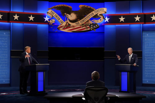 President Donald Trump, left, and Democratic presidential candidate former Vice President Joe Biden, right, with moderator Chris Wallace, center, of Fox News during the first presidential debate on Sept. 29, 2020, at Case Western University and Cleveland Clinic, in Cleveland, Ohio. AP Photo by Patrick Semansky