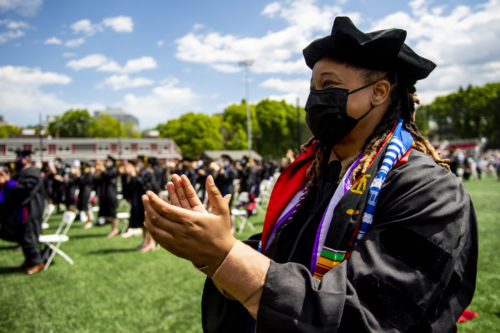 Student clapping during Commencement ceremony