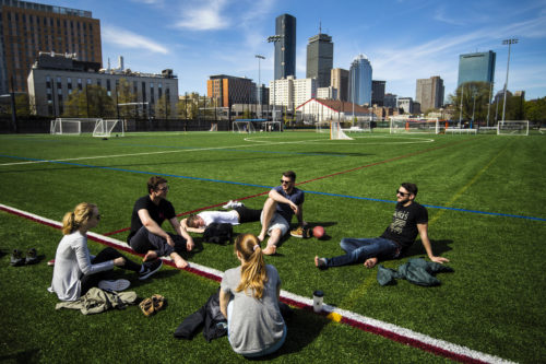 Students sit and relax on Carter Playground. Photo by Adam Glanzman/Northeastern University