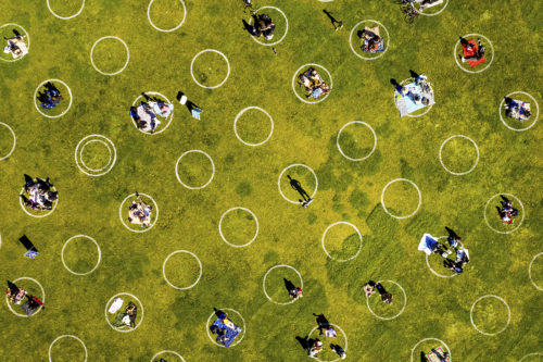 Circles painted on the grass in San Francisco's Delores Park encourage visitors to keep their distance and help prevent the spread of the coronavirus. AP Photo by Noah Berger