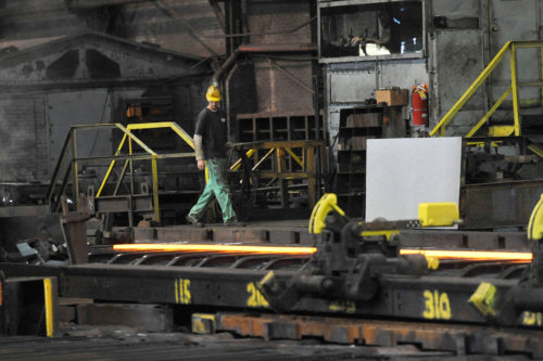 A Gautier Steel, LTD plant mill hand watches as a rolling flat bar passes by during a production run at the Johnstown, Pa. plant. Wednesday, November 8, 2017. AP Photo