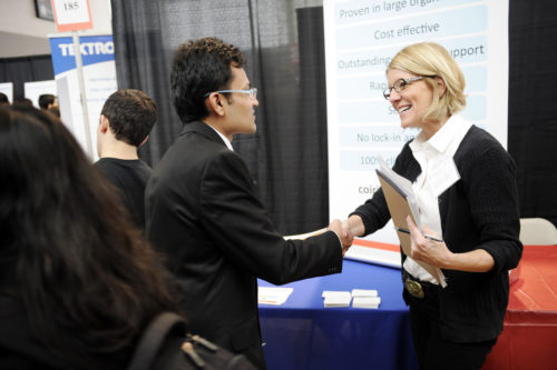 02/05/15 - BOSTON, MA. - Shreyas Karwa, E'15, spoke with Jocelyn Paquette, Technical Recruiting Specialist, Osprey Software Solutions, Inc. during the Spring 2015 Career Fair, held on Solomon Court at Northeastern University on February 5, 2015. Staff Photo: Matthew Modoono/Northeastern University