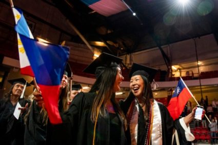Northeastern graduates in the College of Arts, Media and Design celebrates during the ceremony held at Matthews Arena during Commencement week. Photo by Matthew Modoono/Northeastern University