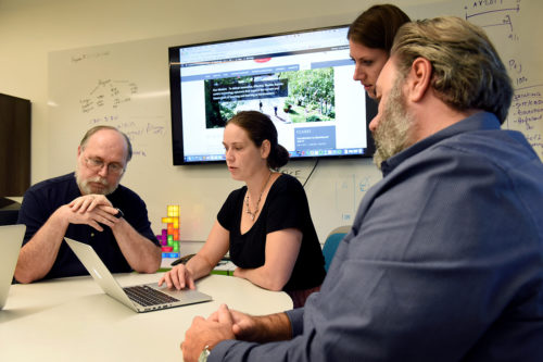 Lindsey Sudbury (center), senior academic instructional technologist in Academic Technology Services, works closely with faculty to help them choose and implement technological solutions for a wide range of classroom goals. <i>Photo by Matthew Modoono/Northeastern University</i>