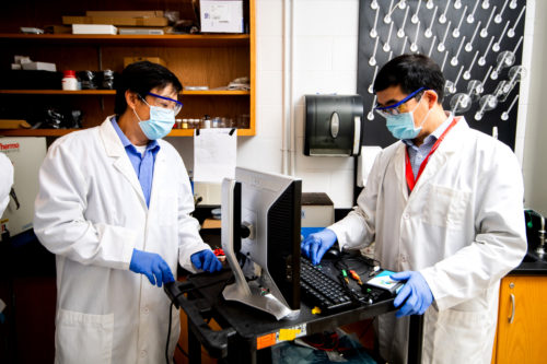 Nian Sun, a professor of electrical and computer engineering, and Hongwei Sun, a professor of mechanical and industrial engineering, work in their lab.
