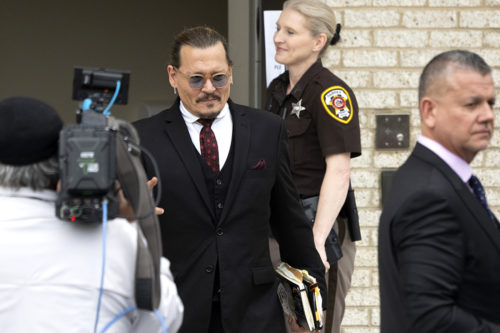 Actor Johnny Depp departs outside court during the Johnny Depp and Amber Heard civil trial at Fairfax County Circuit Court on MAY 18, 2022 in Fairfax, Virginia. Depp is seeking $50 million in alleged damages to his career over an op-ed Heard wrote in the Washington Post in 2018. Photo by Chris Kleponis/Getty Images