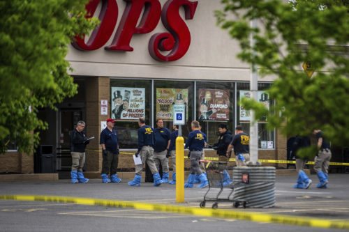 FBI Investigators enter the Tops supermarket in Buffalo, N.Y. on Monday, May 16 2022. AP Photo/Robert Bumsted