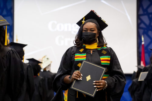 Nicole Thomas, who is earning a Master’s degree in project management, celebrating her second Northeastern degree at the John D. O’Bryant African American Institute’s annual Baccalaureate ceremony.