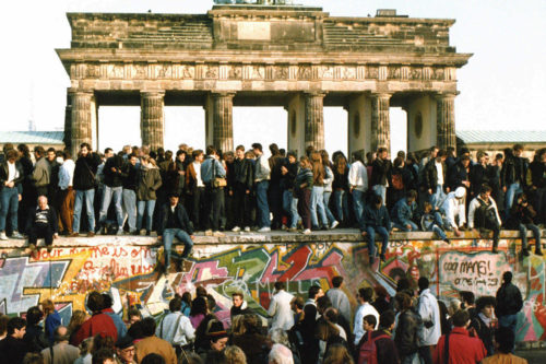 This Nov. 10, 1989 file photo shows Germans from East and West standing on the Berlin Wall in front of the Brandenburg Gate, one day after the wall opened. Monday, Nov. 9, 2009 marks the 20th anniversary of the fall of the Berlin Wall. AP Photo/File