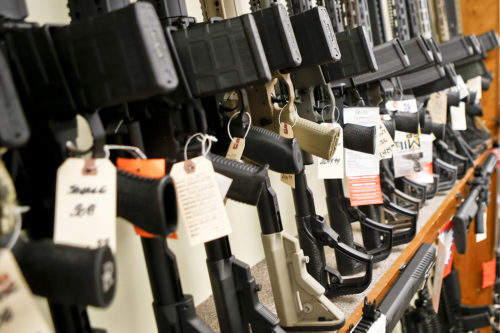 In this Thursday, March 1, 2018, photo a rack displaying various models of semi-automatic sporting rifles is shown at Duke's Sport Shop in New Castle, Pa. AP Photo/Keith Srakocic
