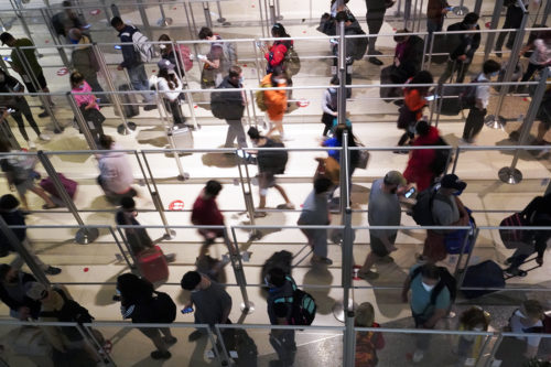 The compounding effects of inclement winter weather and the wildly contagious omicron variant of COVID-19 left airlines in a bind at one of the busiest times of year for travel.  AP Photo/LM Otero