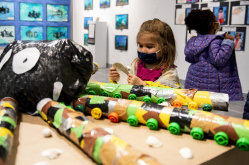 Young artists from the Russell J. Call Children's Center use recycled materials to show how much they have learned about ocean life and the value of conservation. Photo by Matthew Modoono/Northeastern University