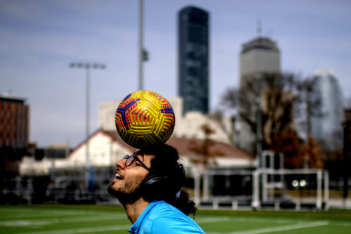 Pedram Keyvani, who studies architecture, juggles a soccer ball on Carter Field. Photo by Matthew Modoono/Northeastern University