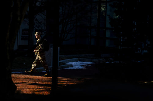 A member of the Northeastern University Army ROTC walks though West Village. Photo by Matthew Modoono/Northeastern University