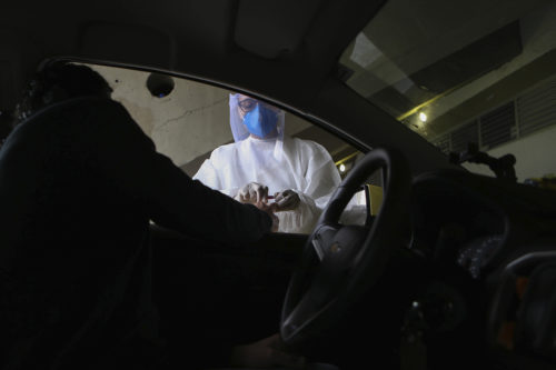 The City of Rio de Janeiro started a test of five thousand taxi drivers in the city on June 15, 2020. The intention is to verify that drivers are not infected with the  coronavirus. PHOTO: WILTON JUNIOR/ESTADAO CONTEUDO (Agencia Estado via AP Images)