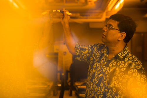 Auroop Ganguly works in his lab in Forsyth building. Photo by Adam Glanzman/Northeastern University