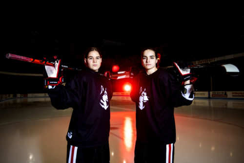 Women’s hockey players Alina Mueller and Chloe Aurard pose for a portrait at Matthews Arena. Mueller and Aurard are the leading scorers of the women’s hockey team. Photo by Ruby Wallau/Northeastern University