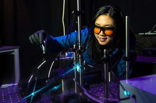Jane Lee works with lasers while studying cancer cells in the Mark Niedre Lab in Northeastern’s Interdisciplinary Science and Engineering building. Photo by Alyssa Stone/Northeastern University