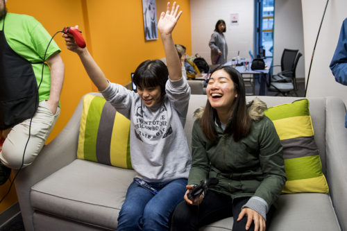 Helen Liu and Bridget Zhou, both second-year students, demo video games in the What's Poppin' space on Dec. 6, 2018. The event was part of Professor Kellian Adams' capstone game design class. Photo by Matthew Modoono/Northeastern University