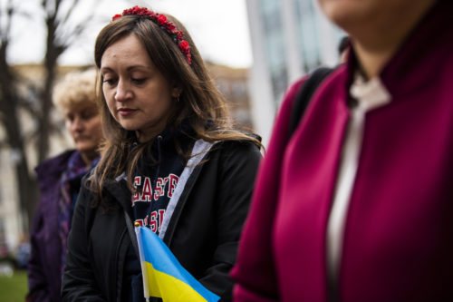 Northeastern graduate and Ukrainian, Khrystyna Reyes shows her support for Ukranian students, joining them in Krentzman Quad as the Ukrainian Cultural Club hosted a national vigil with many area universities participating. Photo by Alyssa Stone/Northeastern University