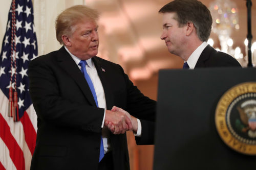President Donald Trump shakes hands with Judge Brett Kavanaugh, his Supreme Court nominee, in the East Room of the White House. (AP Photo/Alex Brandon)
