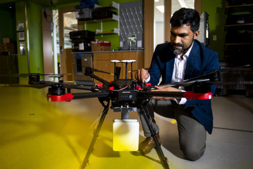 Kaushik Chowdhury, an associate professor of electrical and computer engineering, is working with former graduate student Yousof Naderi to develop technology that transforms any surface into a smart wireless charger to power several devices simultaneously. This system can also be used to power more complex gadgets, such as airborne drones. Photo by Ruby Wallau/Northeastern University