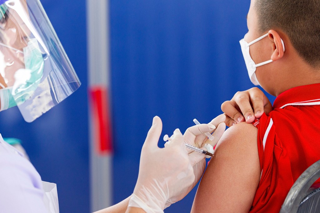 child receiving covid vaccine
