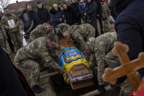 The coffin of senior police sergeant Roman Rushchyshyn is lowered during his funeral in the village of Soposhyn, outskirts of Lviv, western Ukraine in Lviv. Rushchyshyn, a member of the Lviv Special Police Patrol Battalion, was killed in the Luhansk Region. Temporary cease-fires to allow evacuations and humanitarian aid have repeatedly faltered, with Ukraine accusing Russia of continuing its bombardments. AP Photo/Bernat Armangue