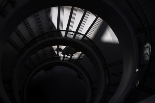 A shadow cast from a Northeastern student is captured while walking down the spiral staircase in the Interdisciplinary Science and Engineering Complex. Photo by Matthew Modoono/Northeastern University