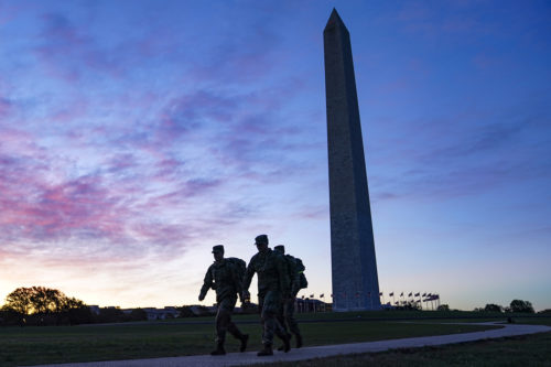 United States National Guard members walk towards the White House from the Washington Monument on Election Day on Nov. 3, 2020, in Washington. AP Photo by John Minchillo