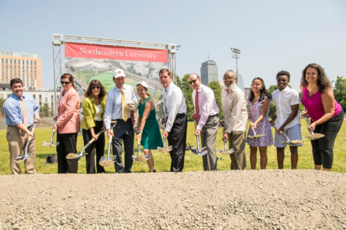 Northeastern President Joseph E. Aoun, Boston Mayor Martin J. Walsh, elected officials, and members of the Northeastern and local communities raise their shovels at the groundbreaking ceremony on Tuesday morning at the new William E. Carter Playground on Columbus Avenue. <i>Photo by Billie Weiss for Northeastern University</i>