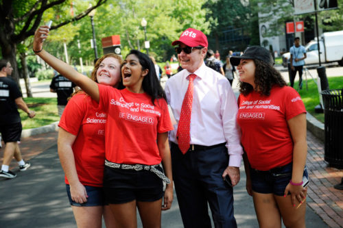 President Joseph E. Aoun walks with students to the Taste of Boston event on Centennial Common following the President Convocation at Matthews Area at Northeastern University on Sept. 8, 2015. Photo by: Matthew Modoono/Northeastern University