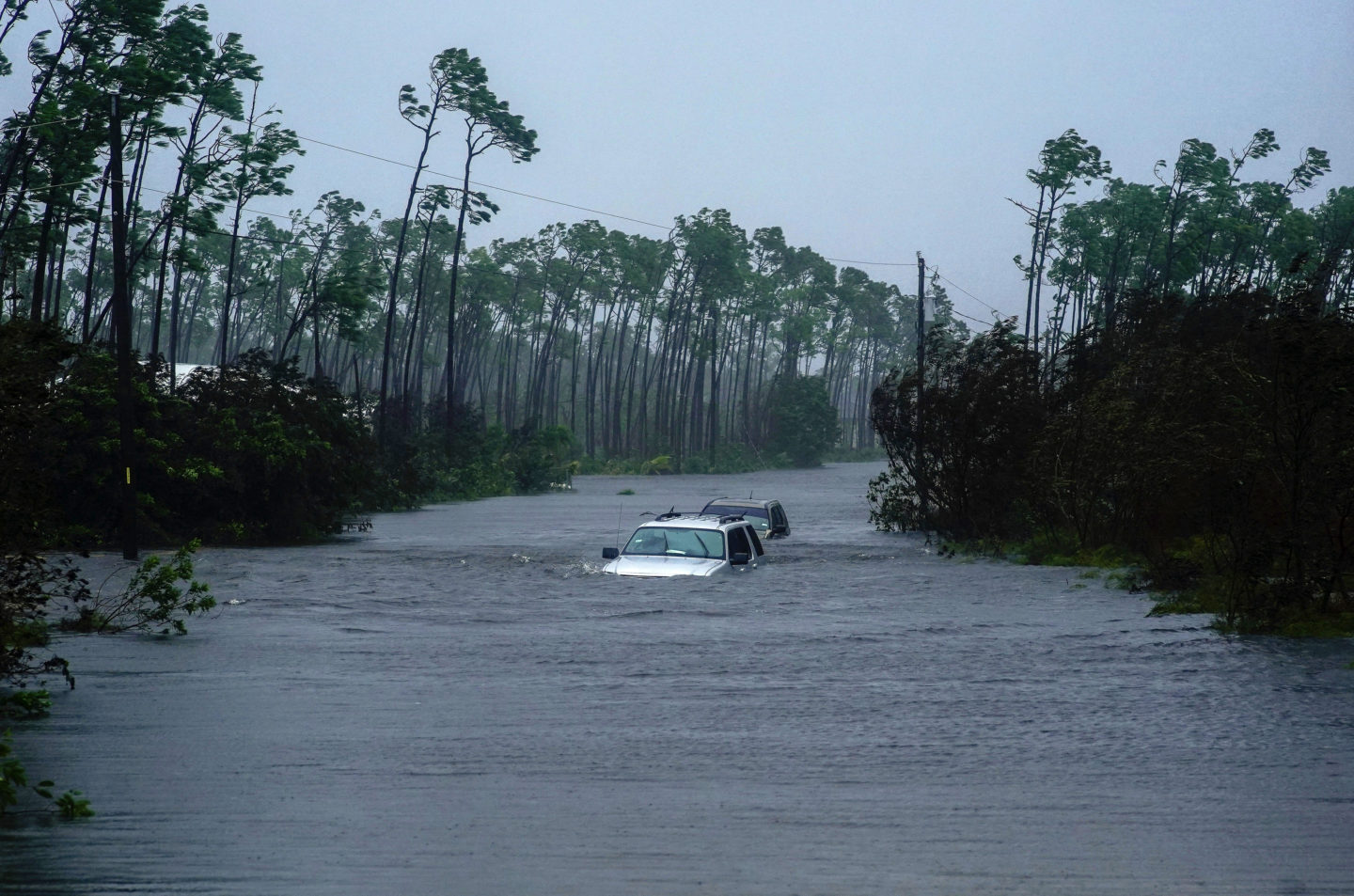 Cars sit submerged in water from Hurricane Dorian in Freeport, Bahamas, Tuesday, Sept. 3, 2019. (AP Photo/Ramon Espinosa)
