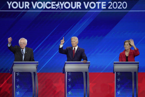 From left, Democratic presidential candidates Bernie Sanders, Joe Biden, and Elizabeth Warren raise their hands to answer a question Thursday, Sept. 12, 2019, during a Democratic presidential primary debate hosted by ABC at Texas Southern University in Houston. (AP Photo/David J. Phillip)