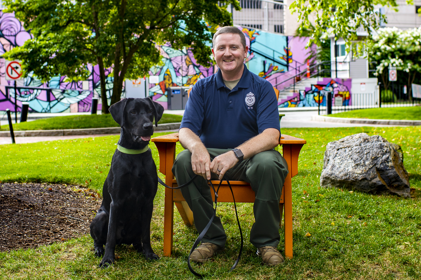 Sarge, a 1-year old black lab and the newest member of Northeastern's pack, explores the Boston campus with his handler NUPD Officer Sgt. Joe Corbett.