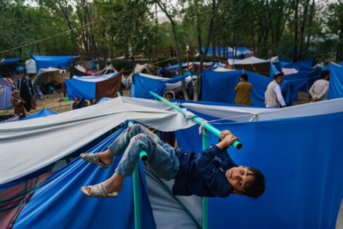 Afghan children pass the time making the most of their surroundings at a makeshift camp for displaced Afghans fleeing the fighting between the Taliban and the Afghan Security Forces at Hasa-e-Awal Park, in Kabul, Afghanistan.MARCUS YAM / LOS ANGELES TIMES