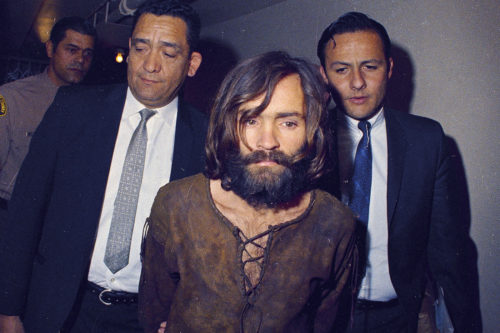 Charles Manson is escorted to his arraignment on conspiracy-murder charges in connection with the Sharon Tate murder case, 1969, Los Angeles, Calif. (AP Photo)