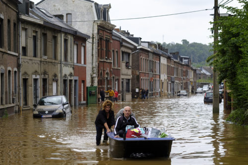 People use a boat to bring man out of home following a severe storm in 'Rue de Tilff' in Angleur, a district from Liège, Belgium. A severe storm and heavy rainfall has caused the Meuse River to flood, damaging thousands of homes and businesses. According to local reports, 23 people have died. Photo by Thierry Monasse/Getty Images