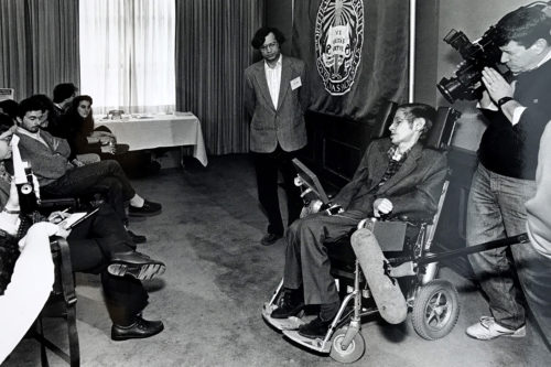 Stephen Hawking interacts with physics students in 1990, as professor Pran Nath moderates the discussion. Photos courtesy of Pran Nath.