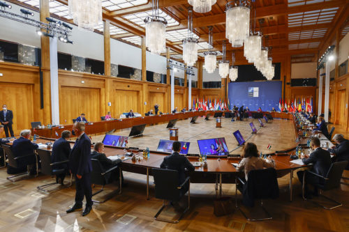 nato foreign ministers sit in a conference room